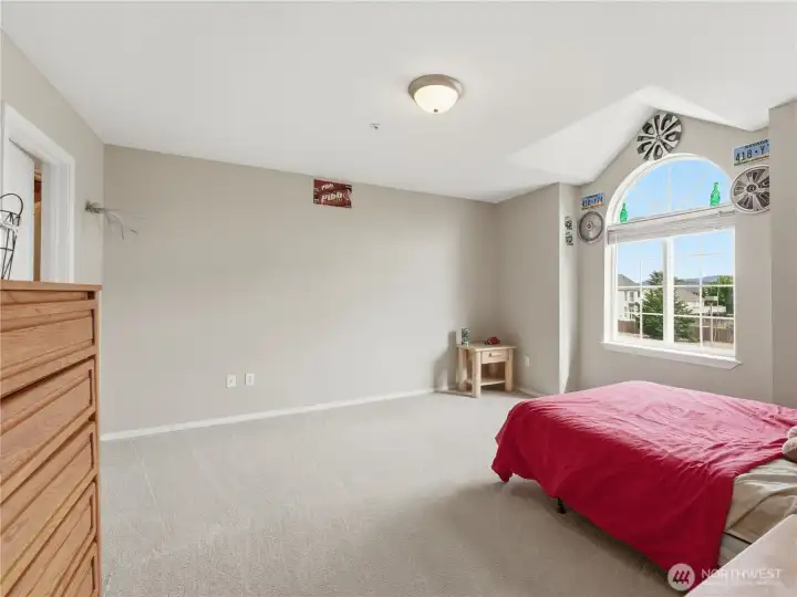 Spacious secondary bedroom featuring a large walk-in closet and comfortable layout.
