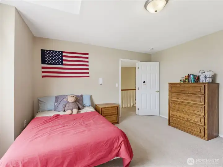 Spacious secondary bedroom featuring a large walk-in closet and comfortable layout.