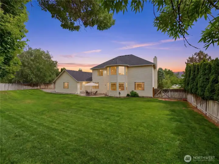 Large fenced backyard ideal for pets, play, gardening, and outdoor entertaining.
