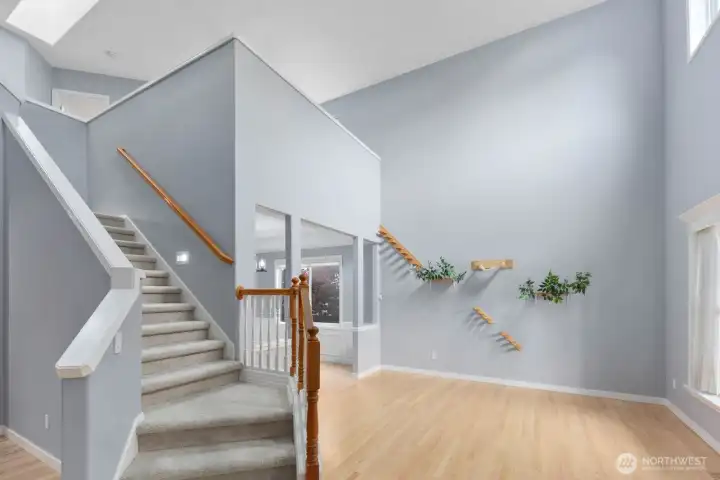Dramatic two-story entry with abundant natural light and an open view of the staircase. Dramatic two-story entry with abundant natural light and an open view of the staircase.