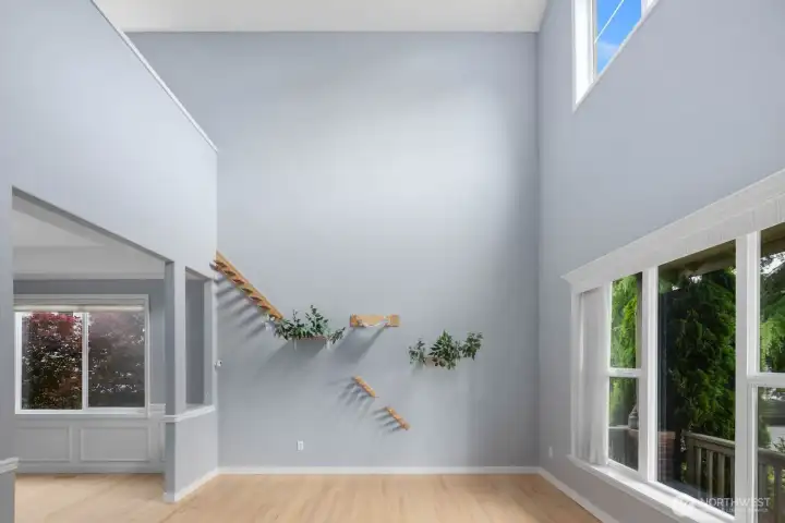 Large windows and soaring ceilings fill this living space with natural light. Large windows and soaring ceilings fill this living space with natural light.