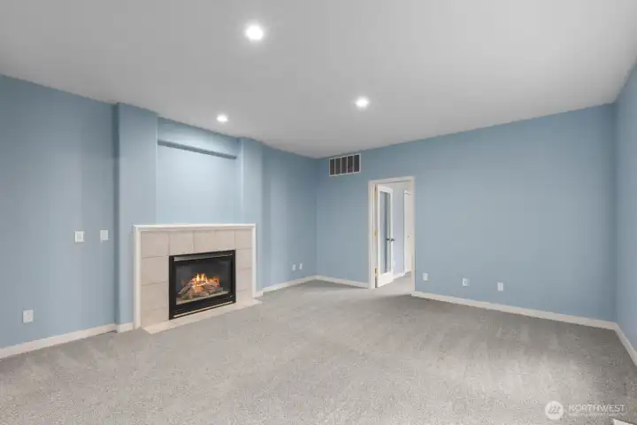 A gas fireplace creates a focal point in this generously sized living area. A gas fireplace creates a focal point in this generously sized living area.