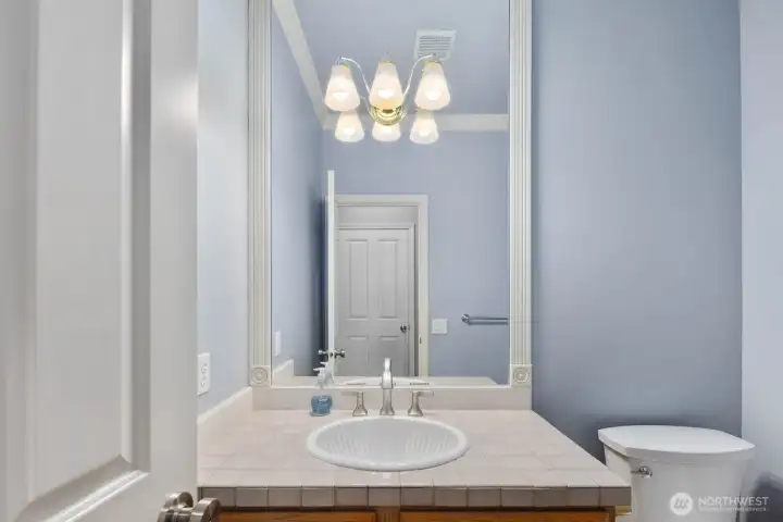 Single-sink vanity with a framed mirror, generous counter space, and a bright, clean layout. Soft wall colors and updated lighting create a fresh, inviting bathroom space. Single-sink vanity with a framed mirror, generous counter space, and a bright, clean layout. Soft wall colors and updated lighting create a fresh, inviting bathroom space.