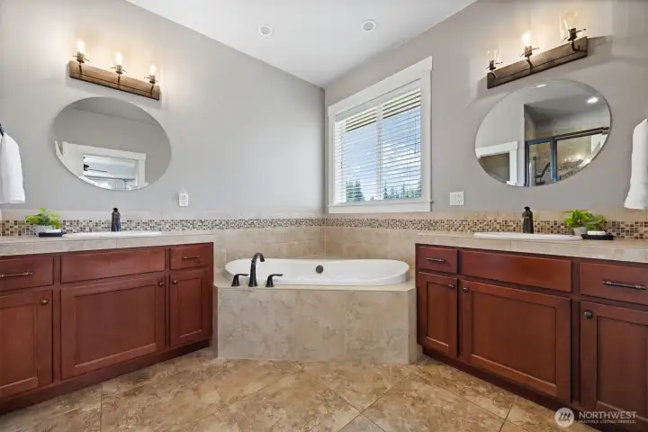 Dual vanities and a soaker jacuzzi