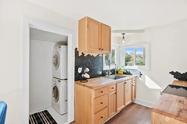 Your washer and dryer await you here, along with convenient access to the backyard through the exterior door, allowing you to step outside without leaving the fenced area.