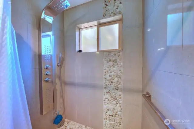 Main floor bathroom with custom walk in shower.
