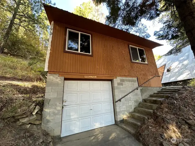 Outbuilding with shop below.