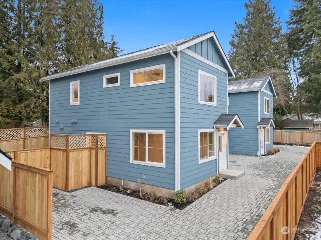 Come see this new construction home with a private garage and an off-street parking spot