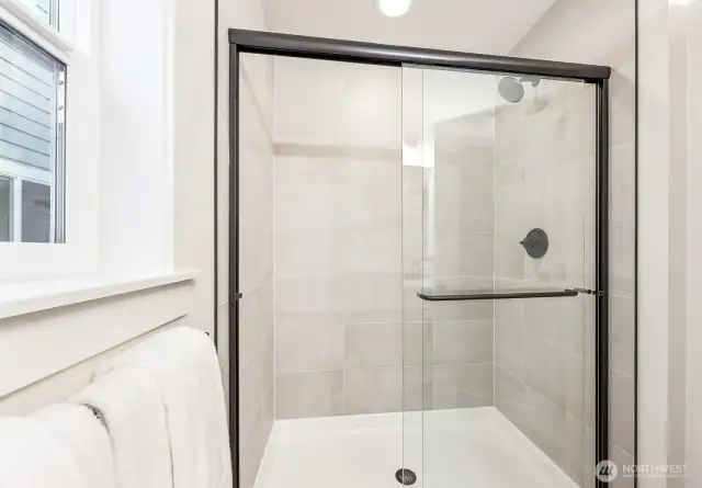 Main floor bathroom. Photos are of the Magnolia model home at Maywood Heights on lot 8. Photos are for illustration purposes only; colors and finishes will vary.