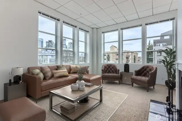 Fall in love with this corner unit, these gorgeous windows say it all. Newer blinds on all will stay.