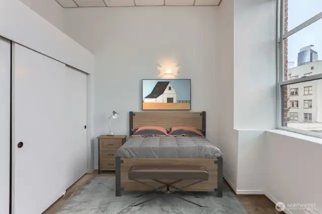 Enjoy all this natural light. Bedroom easily fits a king bed with 1 night stand or a queen with 2.