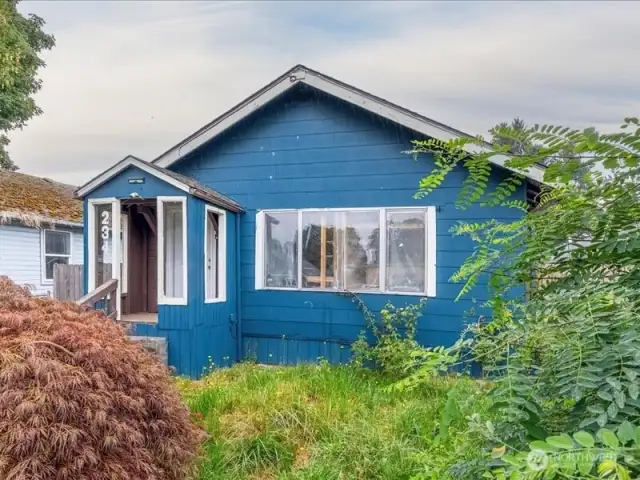 Front of home with landscaping.