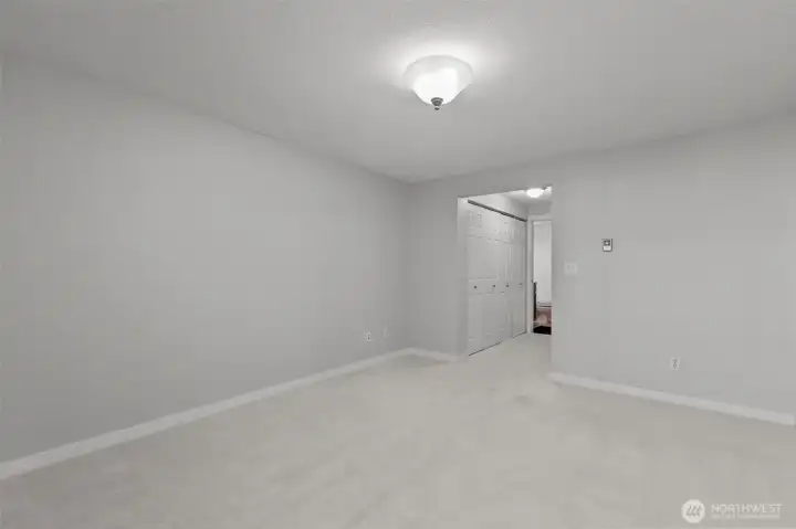 Primary bedroom with ensuite ¾ bath and abundant closet space