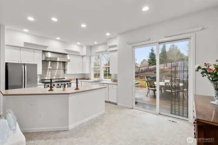 Great kitchen with Stainless "Wolf" double oven and hood fan