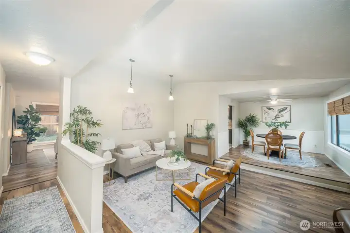 Upon entry, step right to the sunken living space and dining room.