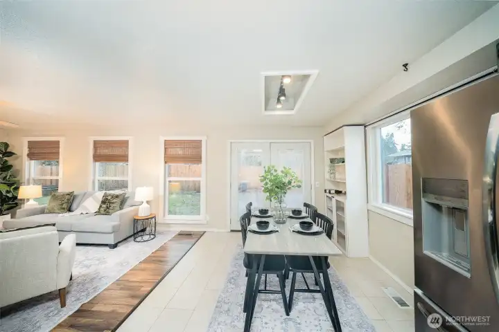 View of additional eating space with large windows and french doors to the patio|back yard.