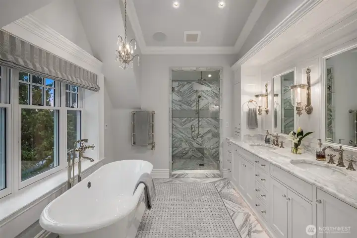 This spa bath is award winning quality. Gorgeous designer lighting, intricate tile and stone, waterworks, heated floors and incredible casework make this primary bath a show piece that you will love to wake up to.