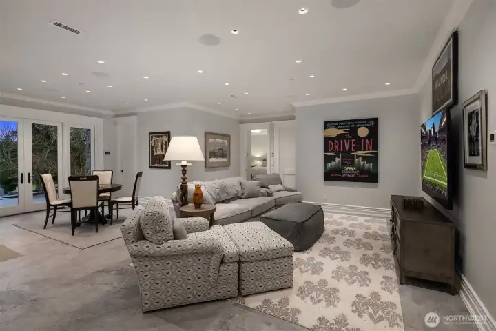 Lower level media game room that opens out to the pool deck.  Come on over and let the good times roll!