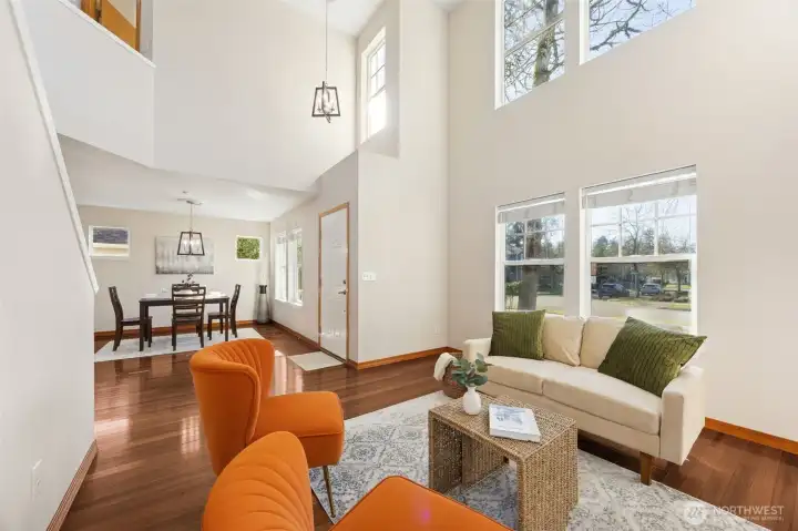 Formal living area with vaulted ceilings. Updated light fixtures and 2" faux wood white blinds.