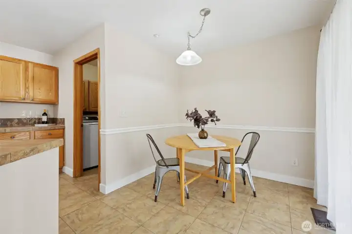 Dining nook off the kitchen by sliding door to back yard.