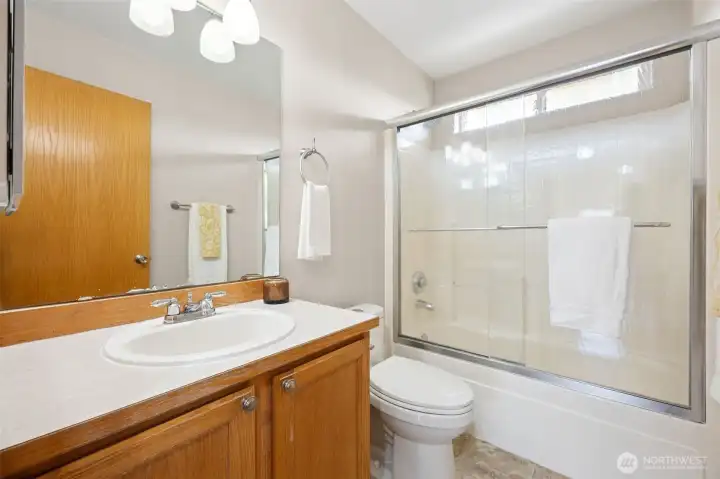Hall bath upstairs with updated shower doors.