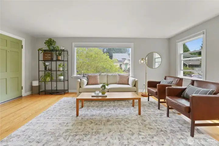 Recently refinished hardwood floors, fresh paint, and an abundance of natural light.
