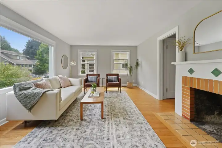 Recently refinished hardwood floors, fresh paint, and an abundance of natural light.