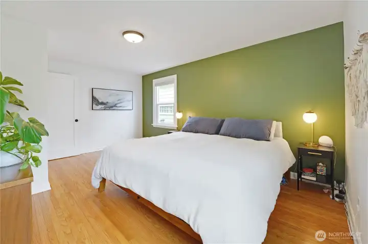 Large primary bedroom with windows facing South and West gives the room tons of natural light.