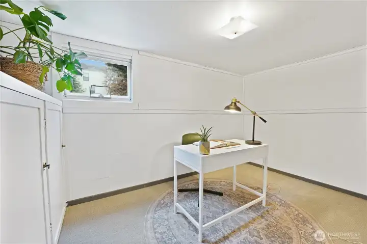 The lower level office space offers considerable storage with painted built-ins.