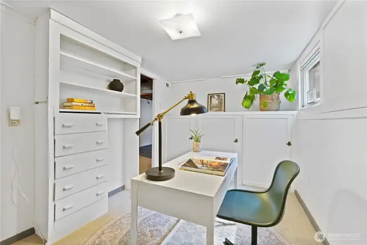 The lower level office space offers considerable storage with painted built-ins.