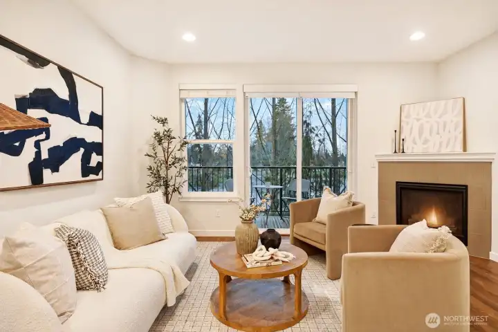 Cozy living room with walk-out balcony and a gas fireplace