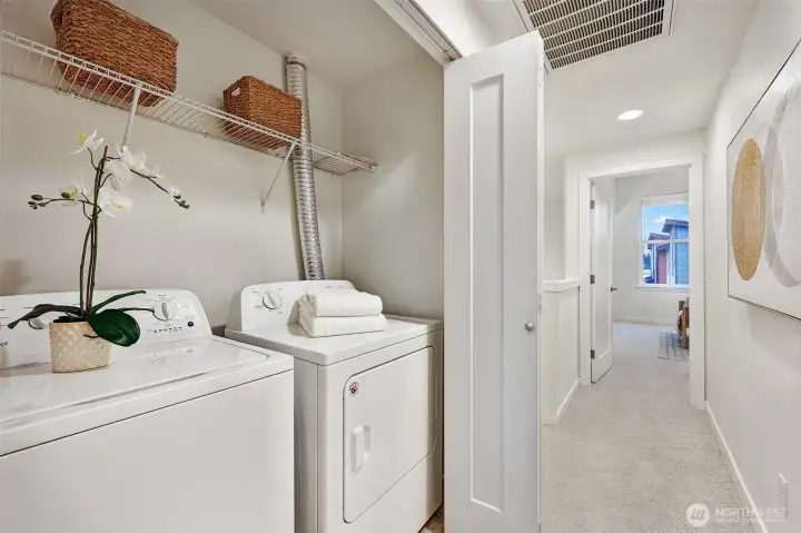 Laundry upstairs hallway near bedrooms for convenience