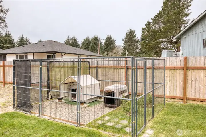 A space for your 4-legged friends complete with trees! Nicley set up with grass and gravel for easy clean up
