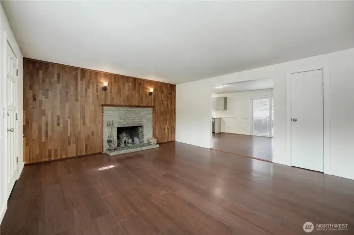 Inviting large living room with durable LVP flooring and a stunning wood-burning fireplace. Open-concept design enhances this updated 1,690 sq ft 4-bedroom home in Redmond’s desirable Union Hill neighborhood with top-rated schools.