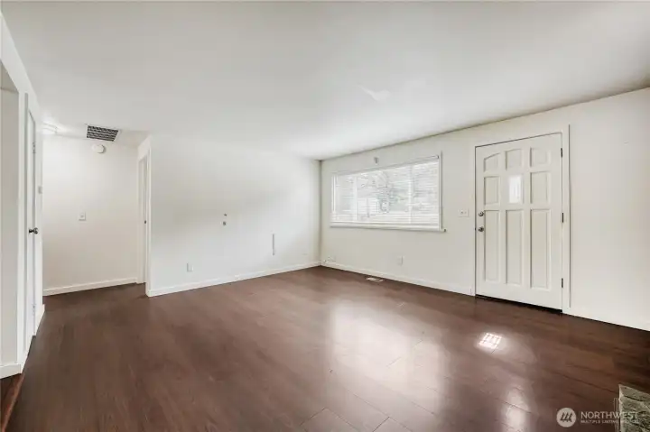 Cozy up to the elegant wood-burning fireplace in this large living area. Paired with modern LVP flooring, it anchors the open-concept space perfectly in this 1,690 sq ft Union Hill home.