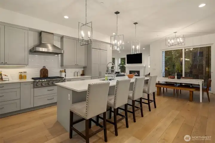 This gourmet kitchen is sure to please with abundant cabinetry, solid surface countertops, complemented by bright white subway tile.