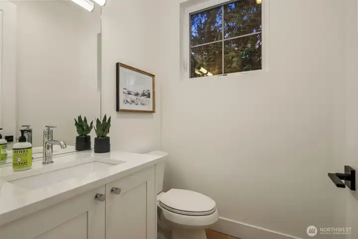 Convenient light and bright powder room located on the main level.