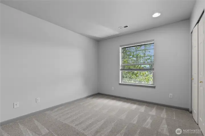 Bright third bedroom offering flexible space for sleeping, working, or hobbies.