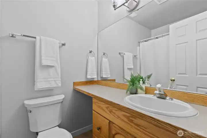 Convenient second full bathroom room with additional storage in the vanity.