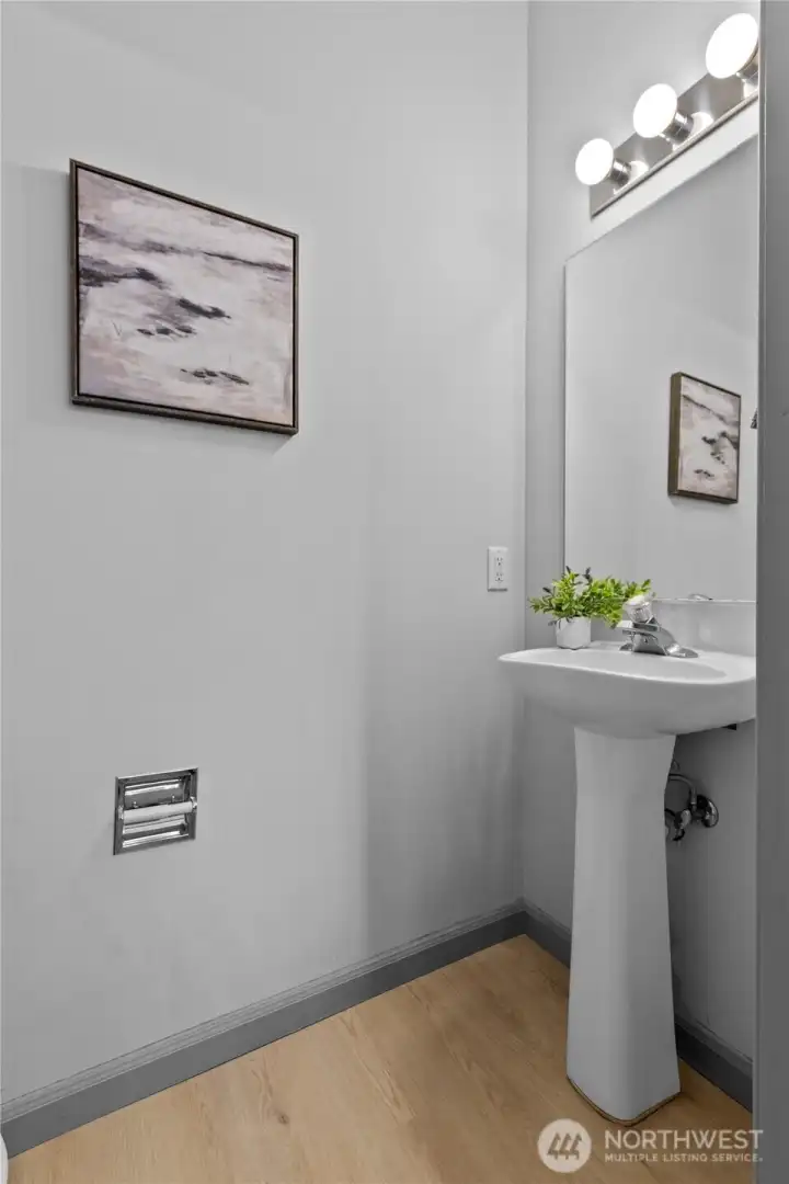 The main-floor powder room adds everyday convenience for both residents and guests.