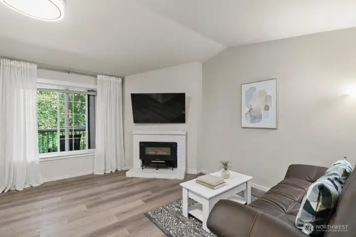 Sun-filled living room with territorial views and updated finishes — the open floor plan buyers want, minutes from Everett Mall.