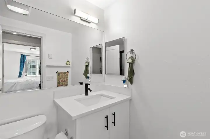 Updated bathroom with double vanity and modern fixtures, reflecting the quality renovations found throughout this Everett condo.