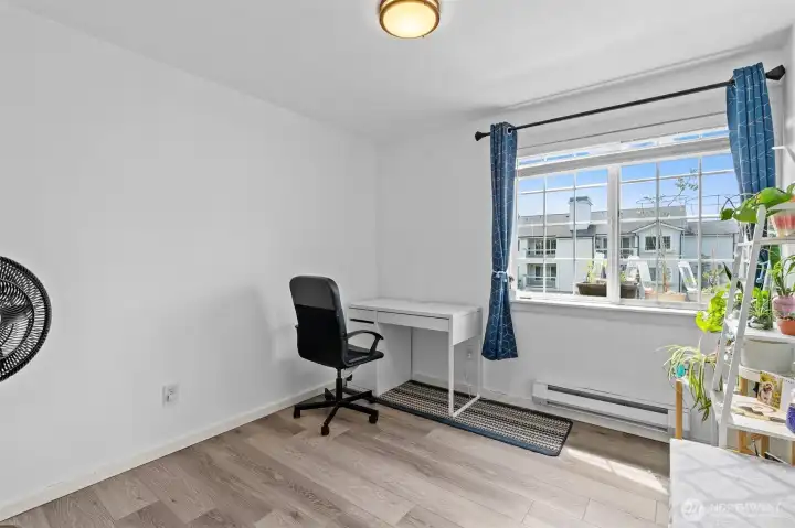 Second bedroom offers flexible space for guests, office, or family in this beautifully renovated Bluegrass Condominiums home.