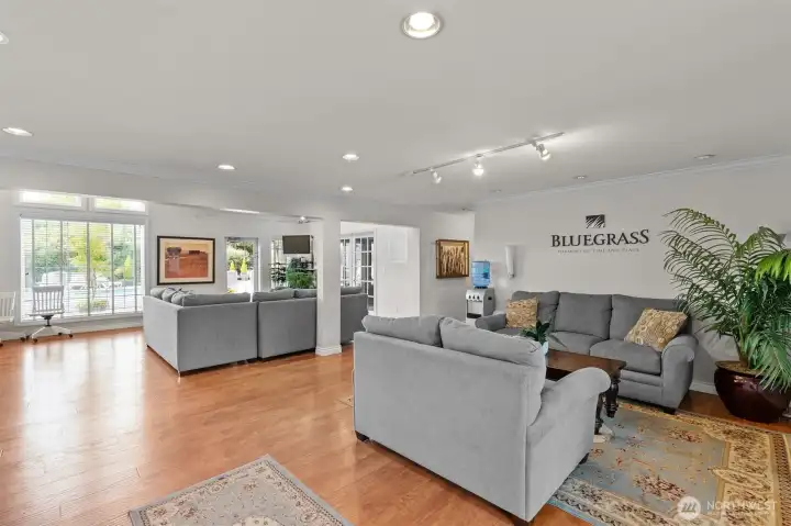 Community clubhouse lounge offers a comfortable gathering space for Bluegrass Condominiums residents.