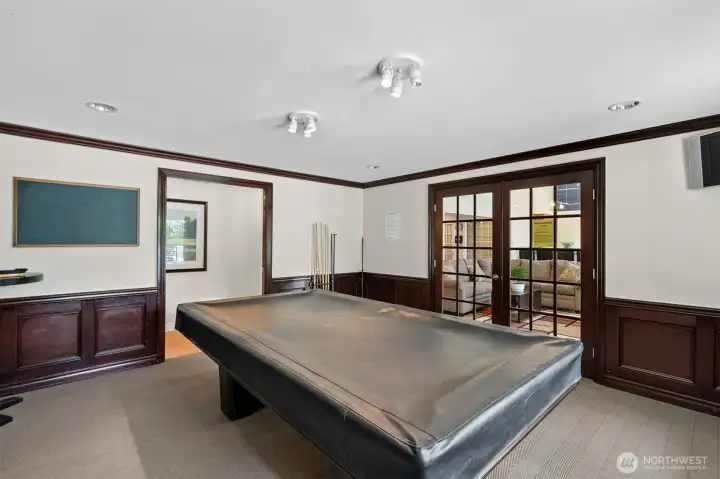 Game room with pool table gives residents extra entertainment space at Bluegrass Condominiums.