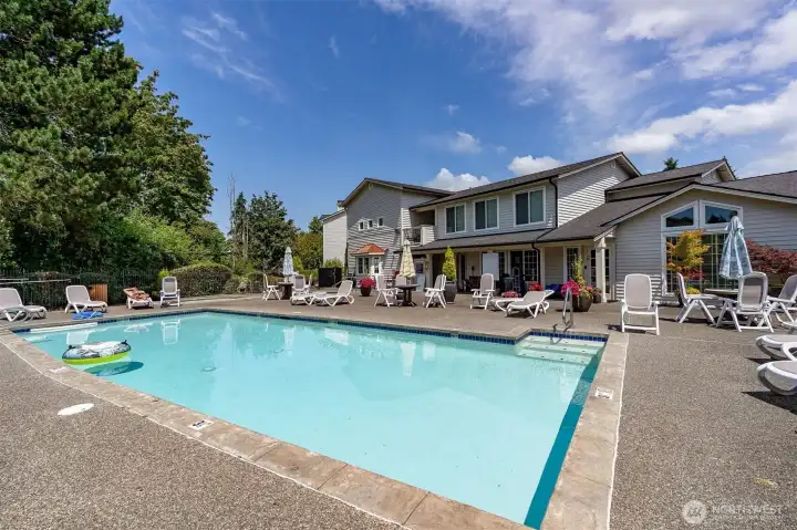 Seasonal outdoor pool at Bluegrass Condominiums offers resort-style relaxation right outside your door in Everett, WA.