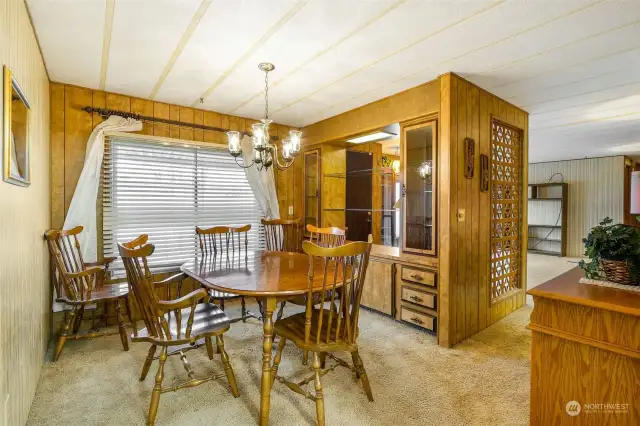 Separate dining room has cabinetry for the diningware, plates and glasses.