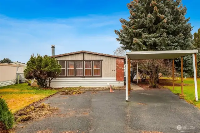 Front of the home shows that there is a lot of room for parking.