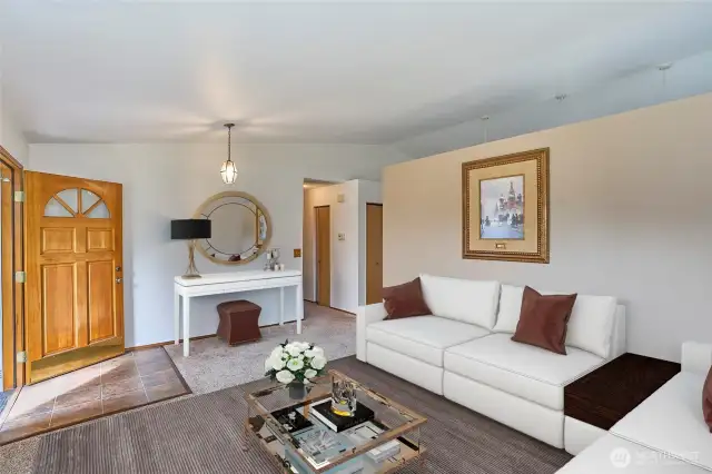 Living room with vaulted ceilings.