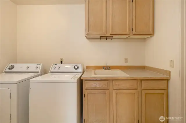 Utility room with access to attached 2 car garage